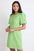 Feel ultra chic in the Emory apple green mini dress from Stories be Told, available from www.thecollectivenz.com