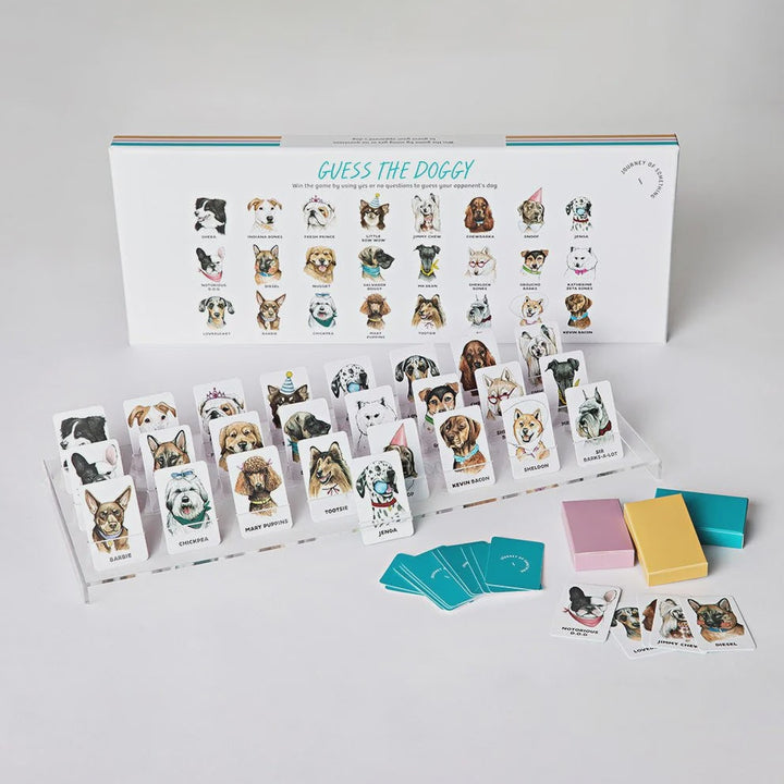 Guess the Doggy game set with cards and a book on a white background