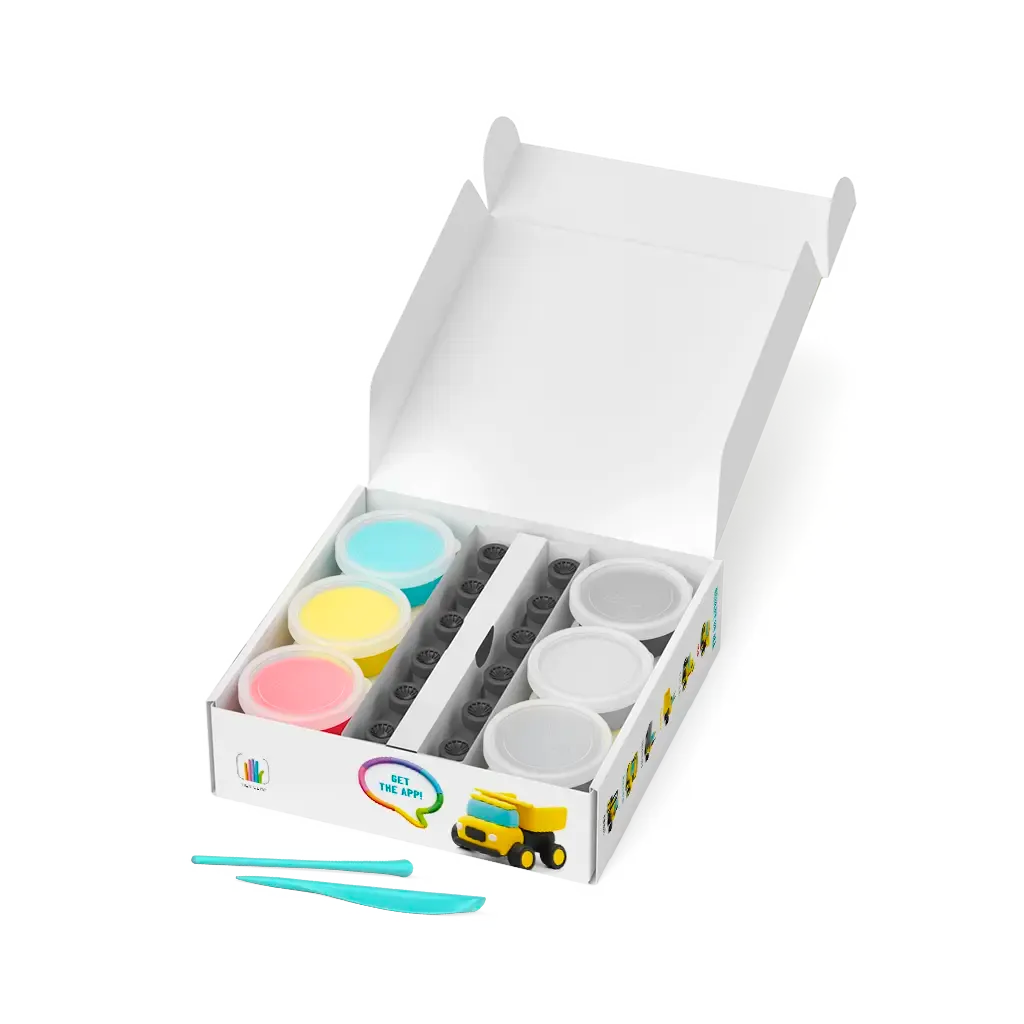 Set of colorful play dough containers with tools in a white box on a white background