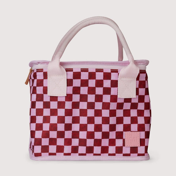Checkered handbag with pink and red pattern on a light gray background