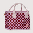 Checkered bag with pink handles on a light gray background
