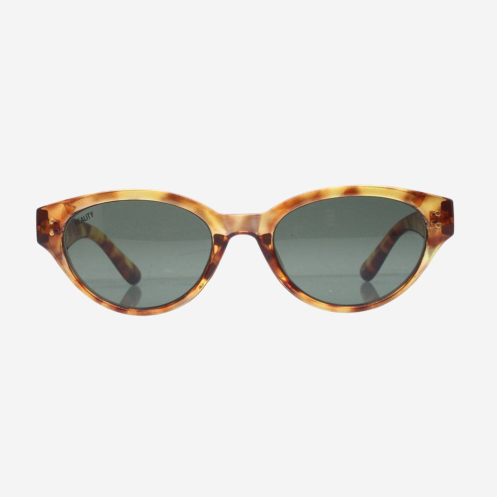 Oval sunglasses with a tortoiseshell patterned frame and dark gray lenses, shown against a plain light gray background.