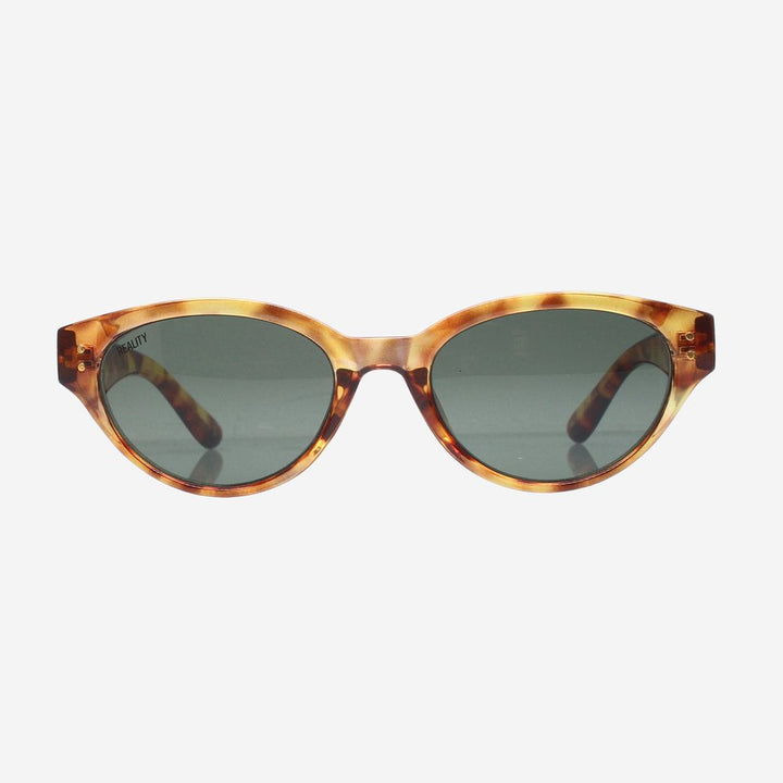 Oval sunglasses with a tortoiseshell patterned frame and dark gray lenses, shown against a plain light gray background.