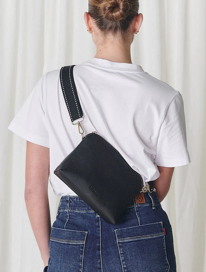 Our Hudson Cross Body Bag combines style and function with two removable straps: a classic PU strap with gold chain and a playful striped webbing strap. Available from www.thecollectivenz.com