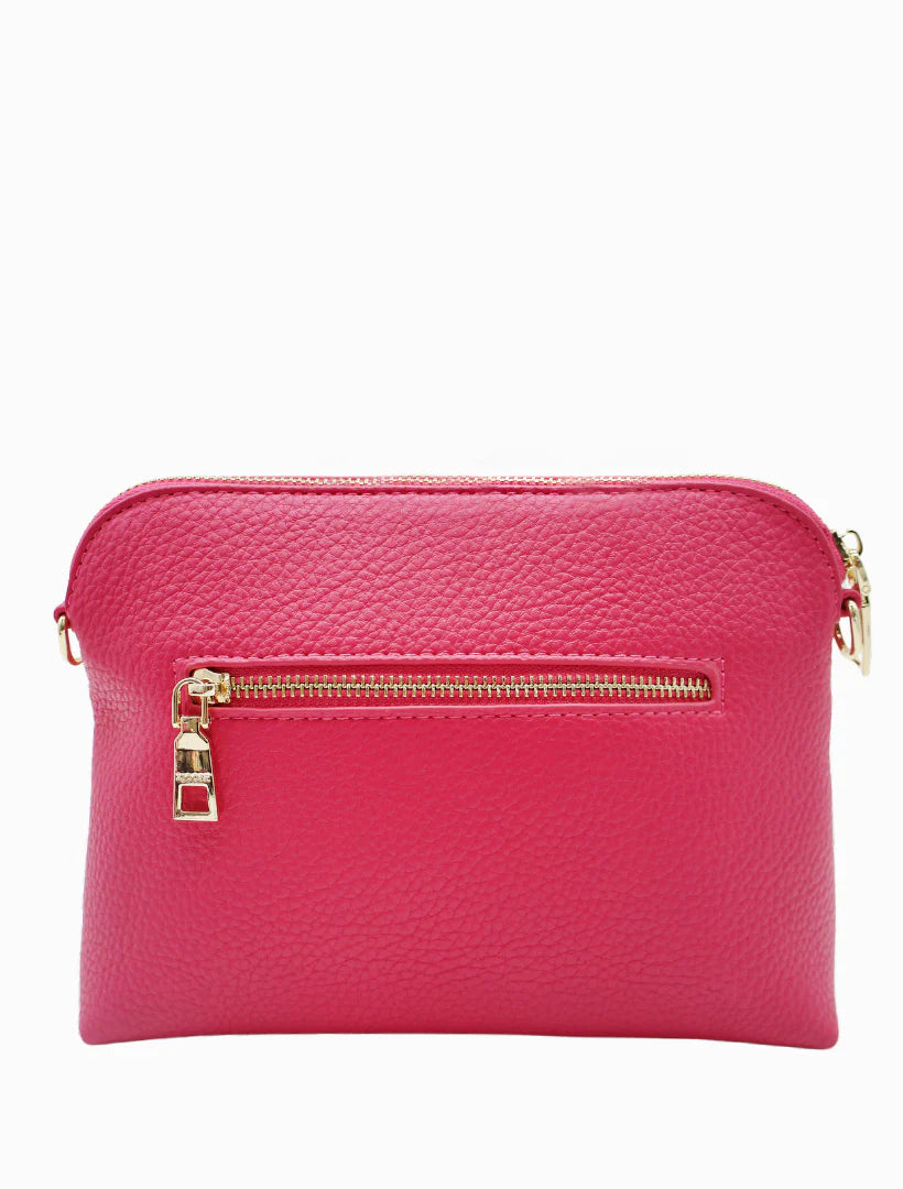 Our Hudson Cross Body Bag combines style and function with two removable straps: a classic PU strap with gold chain and a playful striped webbing strap. Available from www.thecollectivenz.com