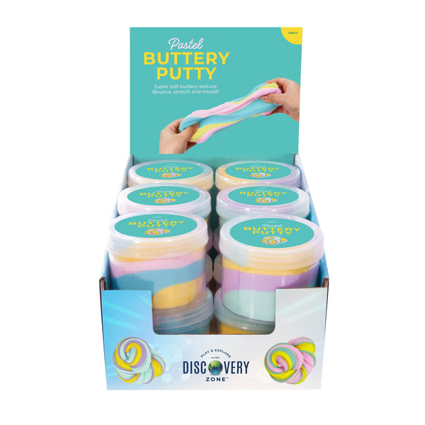 Display box of pastel buttery putty with Discovery Zone branding.