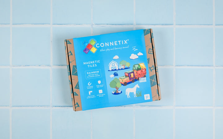 Connetix magnetic tiles packaging on a blue tiled surface