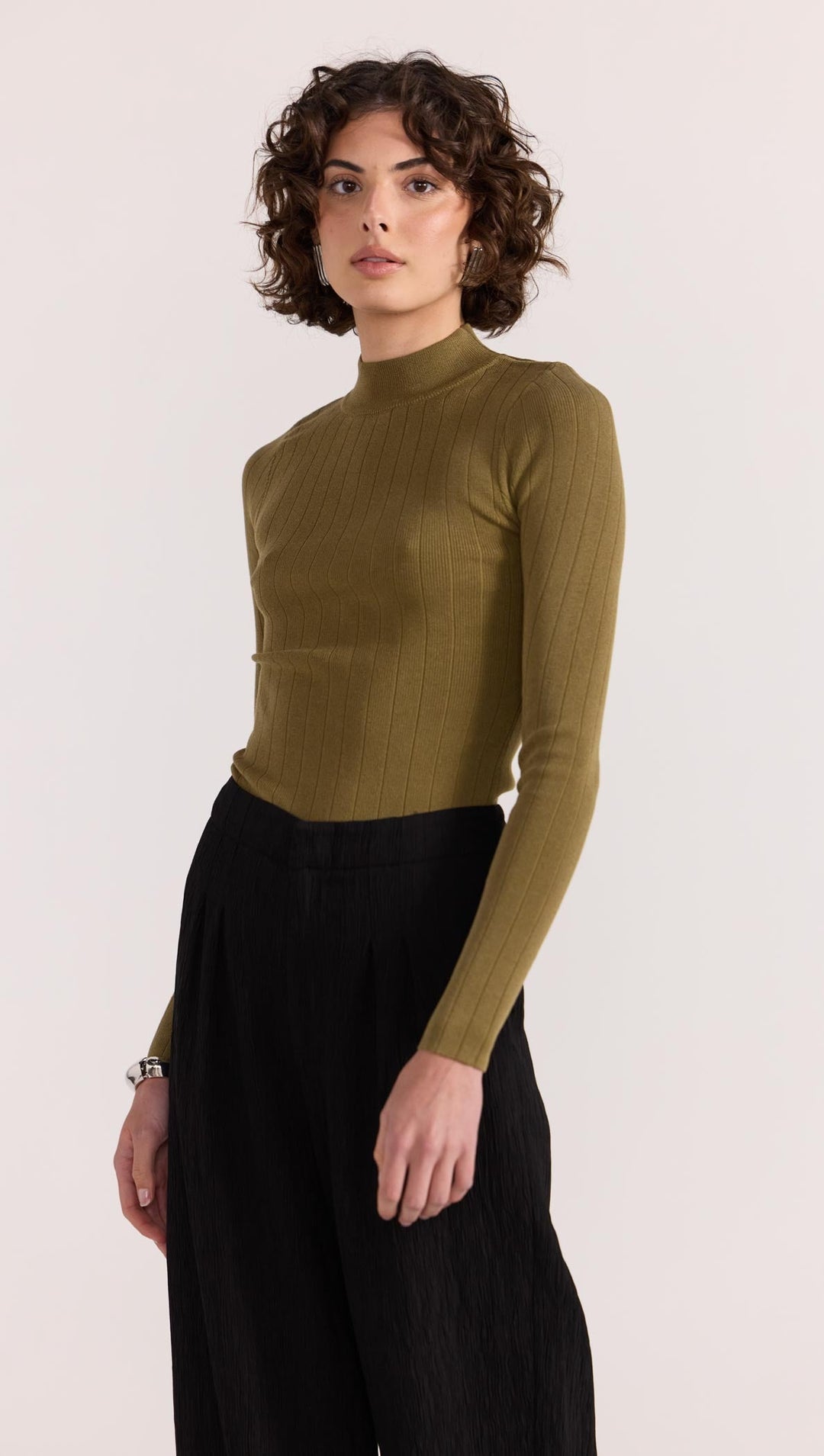 The Renee Rib Knit Top by Staple the Label is a timeless wardrobe essential. Featuring a fitted silhouette, and stretchy rib knit fabrication.  Available from www.thecollectivenz.com