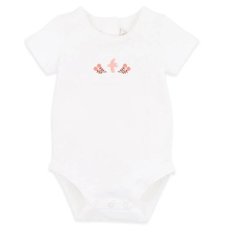 White baby onesie with pink floral design on a white background