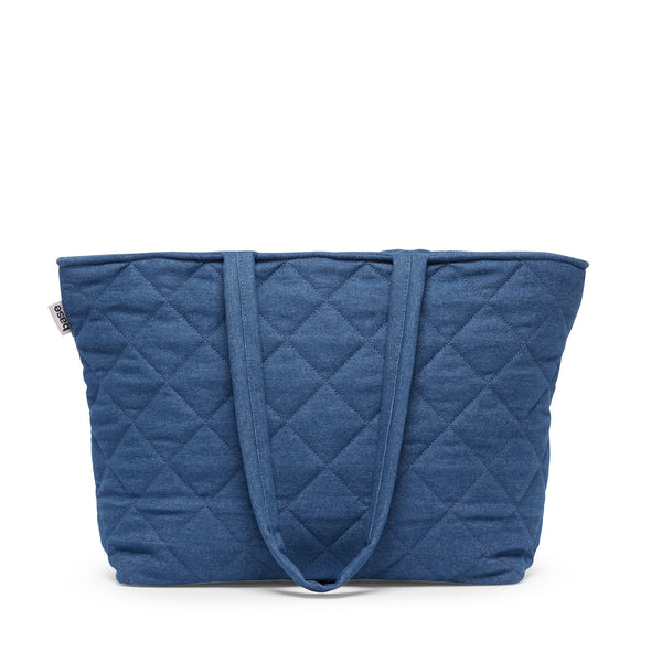 Blue quilted tote bag on a white background