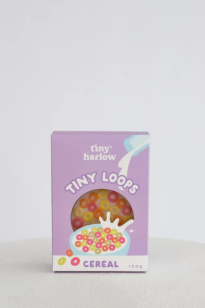 Box of tiny loops cereal with a purple background
