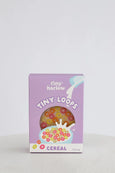 Box of tiny loops cereal with a purple background