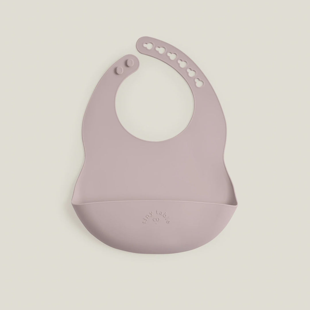 Silicone bib on a light beige background