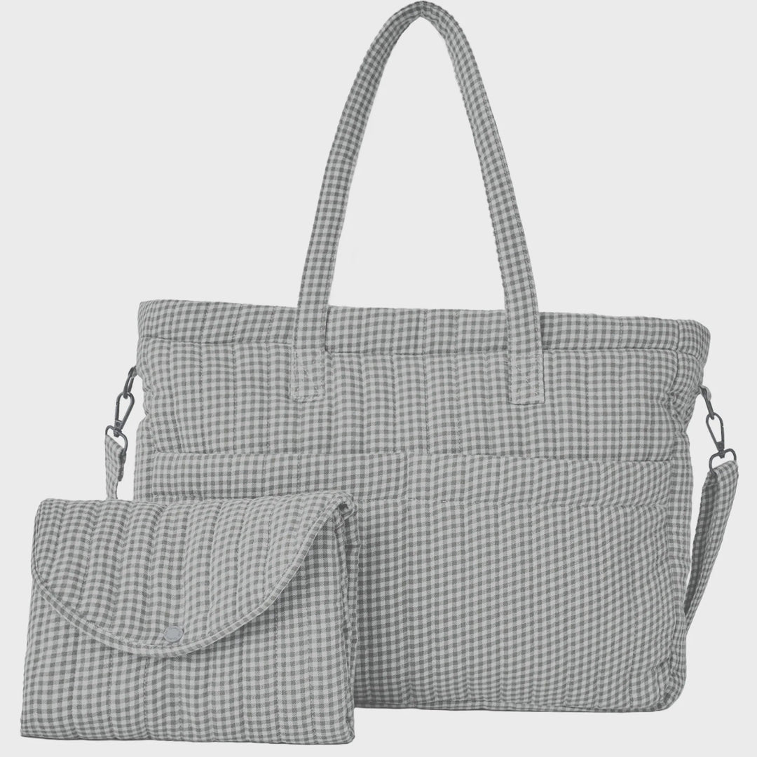 A gray and white gingham check diaper bag set with a matching small pouch, shown against a light gray background.