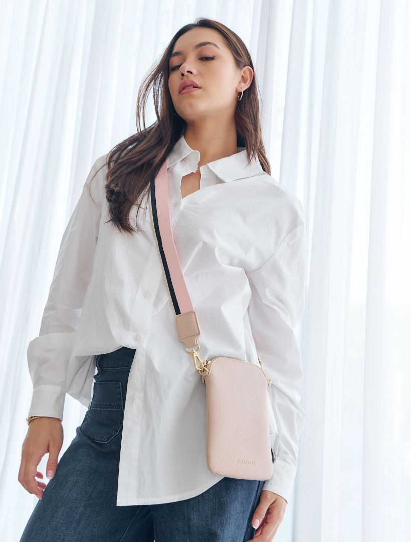 The Wanderer Cross Body Bag by Zjoosh is just the right size to carry a phone, lip gloss, cards and keys. With 4 internal card holders and an external zipper pocket on the back, she keeps all your easy to loose items safe. Available from www.thecollectivenz.com