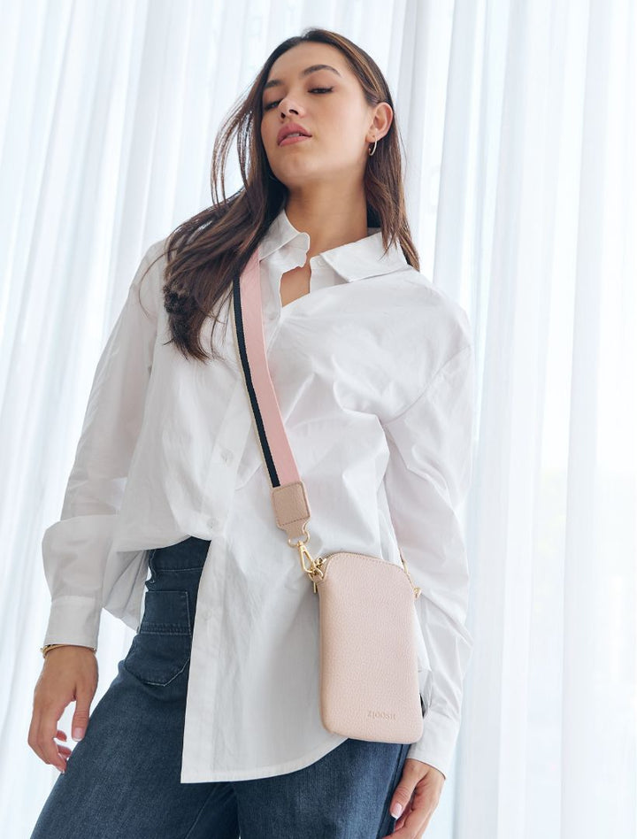 The Wanderer Cross Body Bag by Zjoosh is just the right size to carry a phone, lip gloss, cards and keys. With 4 internal card holders and an external zipper pocket on the back, she keeps all your easy to loose items safe. Available from www.thecollectivenz.com
