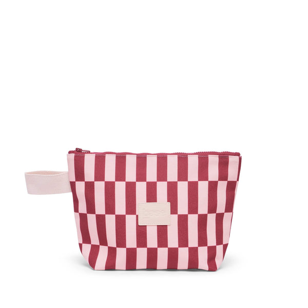 Pink and red striped bag with a white zipper on a white background