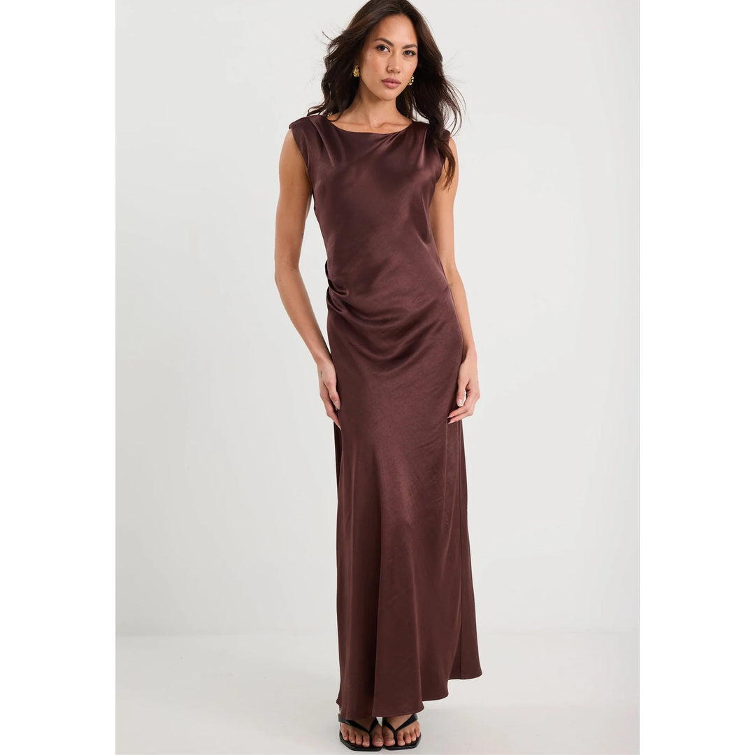 Woman wearing a brown dress on a white background