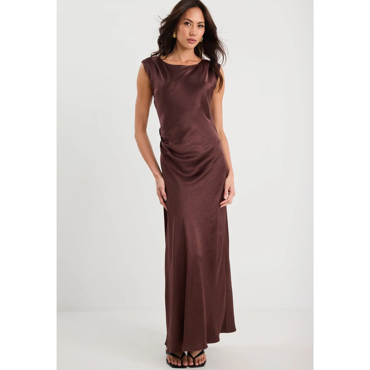 Woman wearing a brown dress on a white background