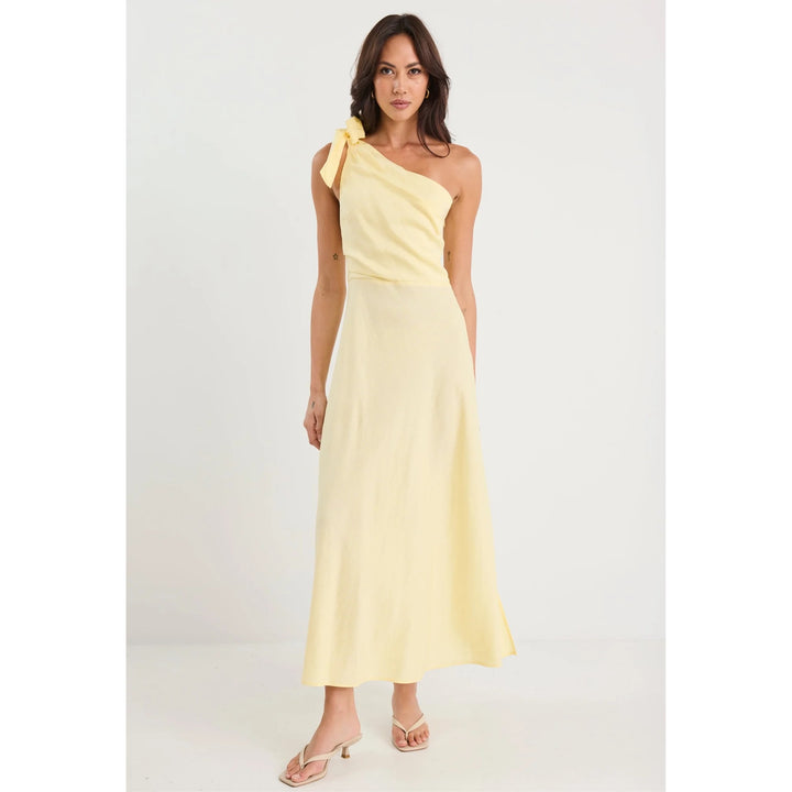 Woman wearing a yellow one-shoulder dress on a white background