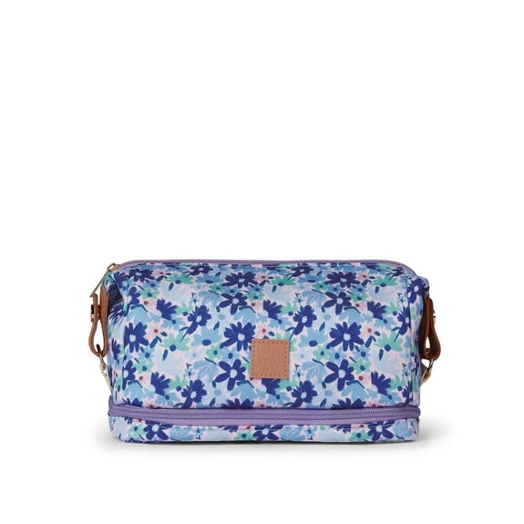 Floral patterned bag with a visible brand logo on a white background
