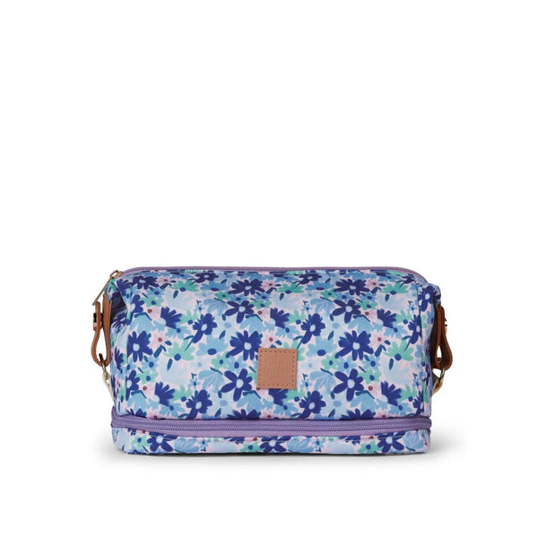 Floral patterned bag with a visible brand logo on a white background