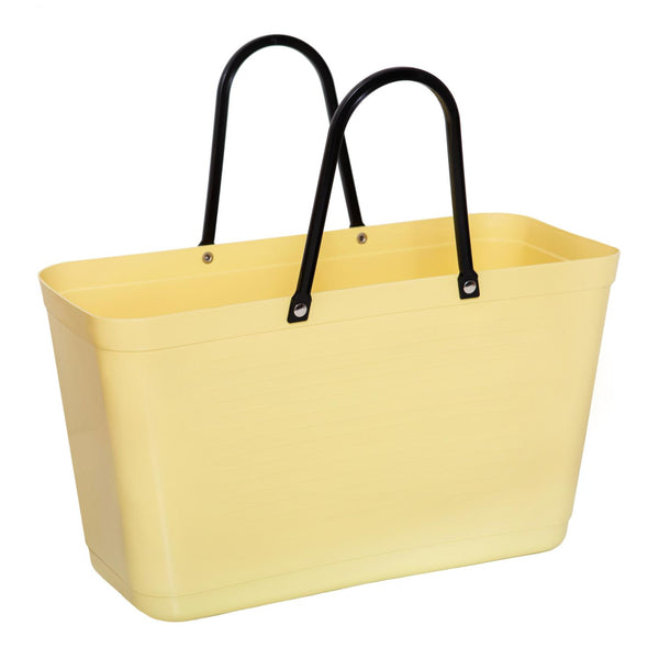 Yellow tote bag with black handles on a white background