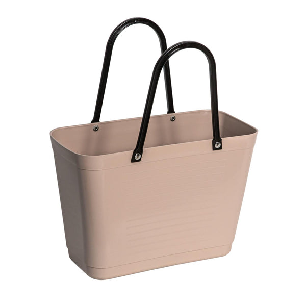Beige tote bag with black handles on a white background