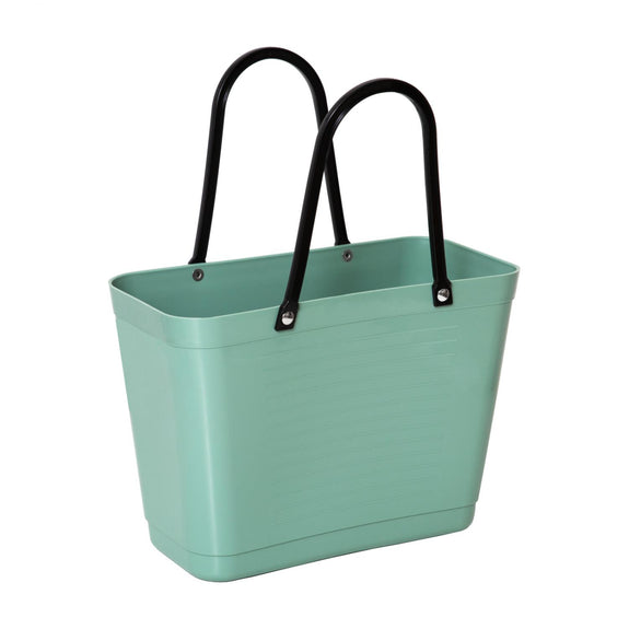 Green tote bag with black handles on a white background