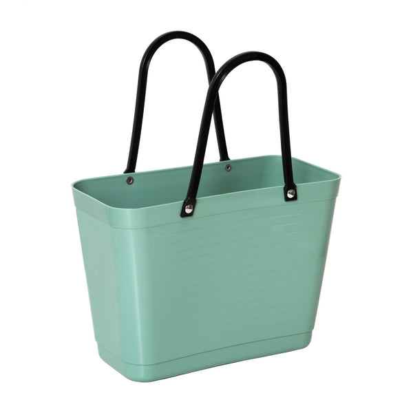 Green tote bag with black handles on a white background