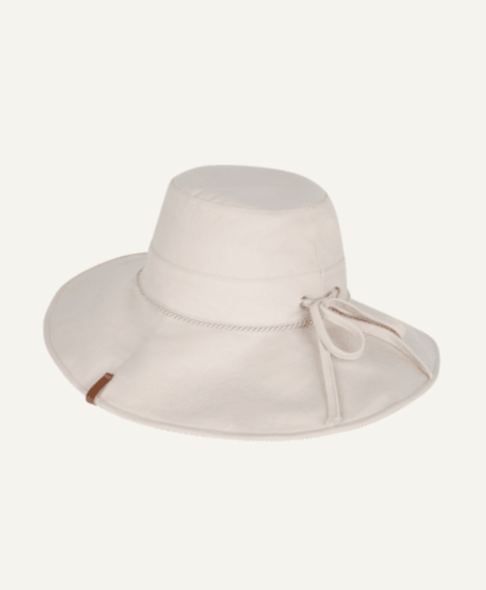 Beige wide-brimmed hat with a tie on a white background