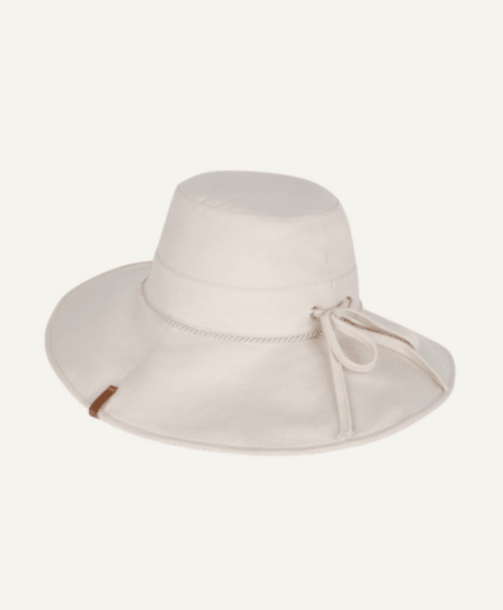 Beige wide-brimmed hat with a tie on a white background