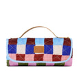 The Somewhere co Multicolored quilted picnic rug with a handle on a white background