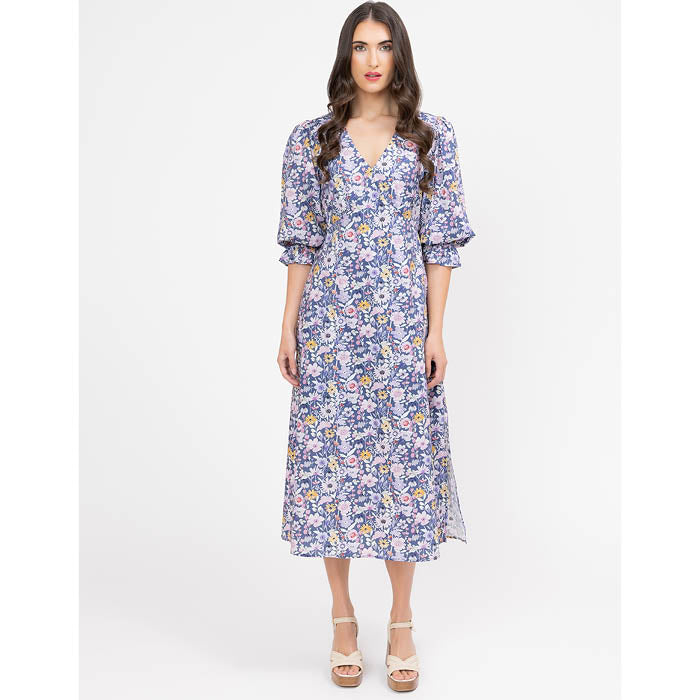Woman wearing a floral dress on a white background