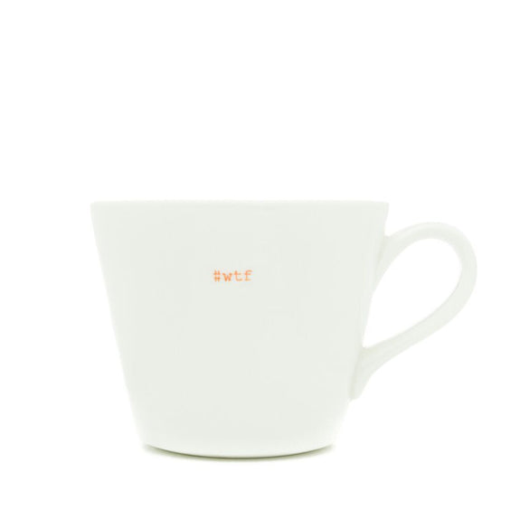 White mug with 'WTF' printed on it against a white background
