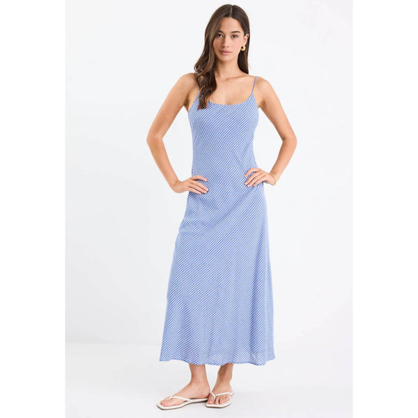 Woman wearing a blue and white striped dress on a white background