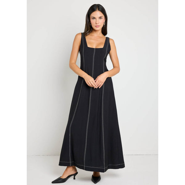 Embrace minimalist sophistication with the Index black dress. Its sleek square neckline and contrast stitching details create a modern, tailored silhouette. Available from www.thecollectivenz.com