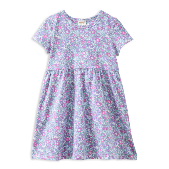 Floral dress with pink and purple flowers on a white background