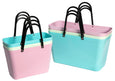 Set of colorful storage baskets with black handles on a white background