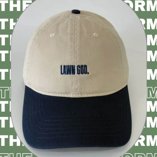 Two-tone cap with 'Lawn God' text on a green background with text overlay