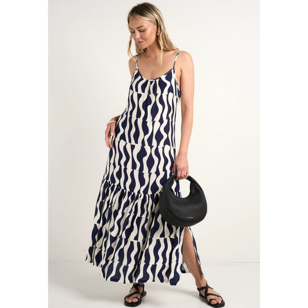 The Relax strappy tiered midi dress is a flowy, midi featuring a geometric wave pattern in navy and white available from www.thecollectivenz.com