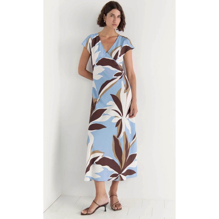 Woman wearing a floral dress with a white background