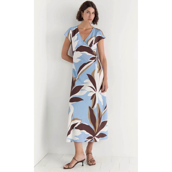 Woman wearing a floral dress with a white background