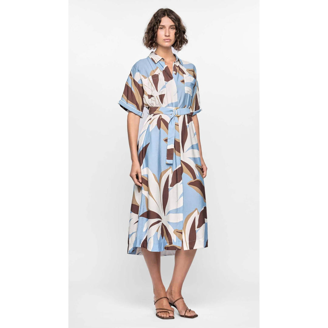 Woman wearing a patterned dress on a white background
