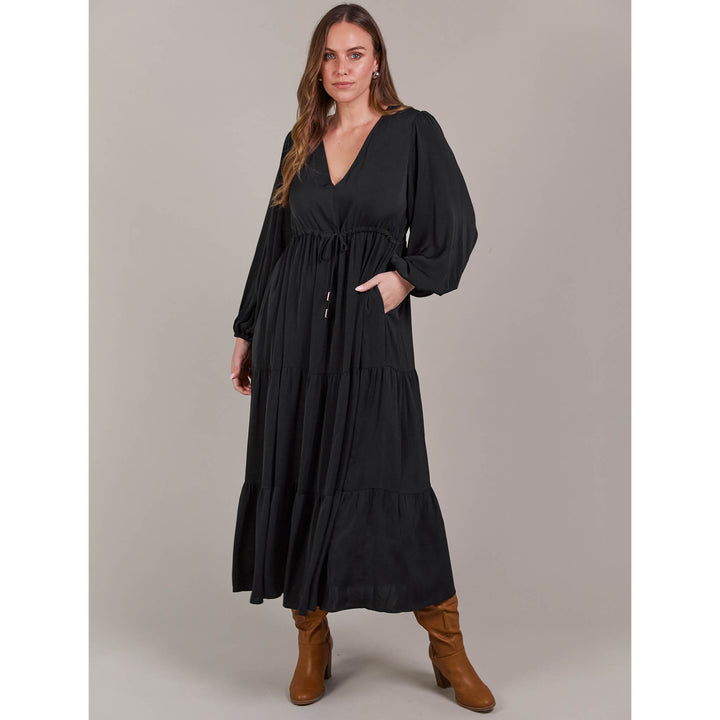 The Elsie Maxi Dress is the ultimate expression of effortless sophistication. Its flattering V-neck flows seamlessly down to an adjustable drawstring, designed to enhance and define your figure. Available from www.thecollectivenz.com