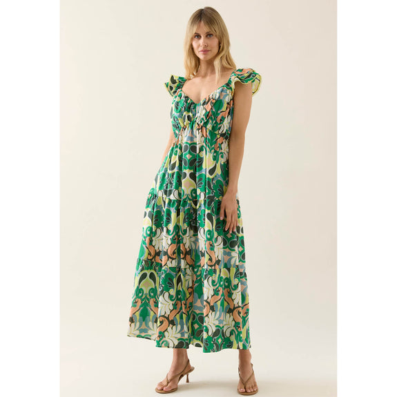Woman wearing a floral isle of mine dress on a white background