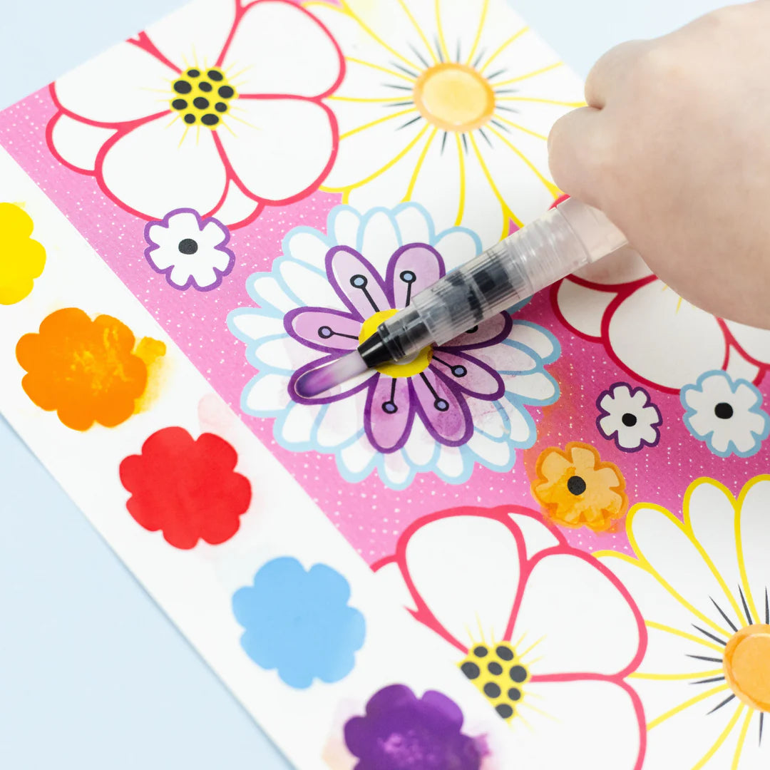 Colorful flower stickers on a sheet with a hand holding a marker.