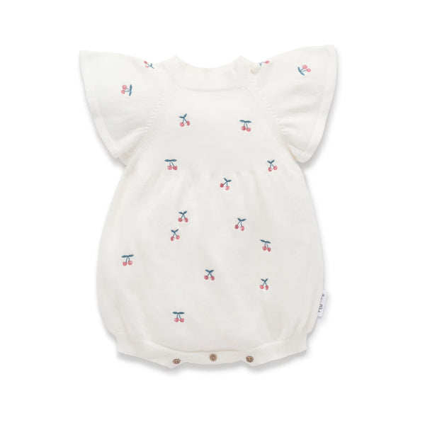 Baby romper with cherry pattern on a white background
