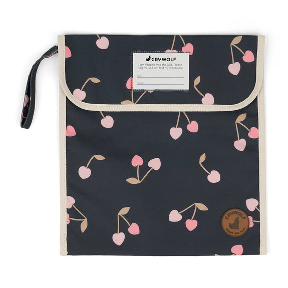 Black pouch with pink cherry pattern and Crywolf branding on a white background