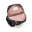 Black backpack with pink floral pattern on a white background